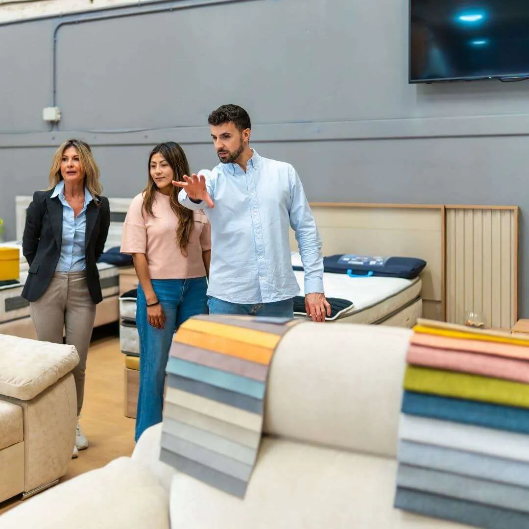 sales person showing furniture products to prospects